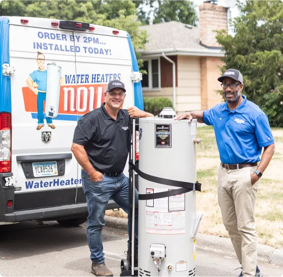 Image of a plumber holding a water heater